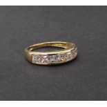 14ct yellow gold white and pink sapphire half eternity ring, set with seven princess-cut stones, 2.