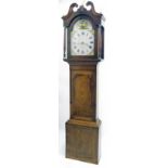 Oak and mahogany crossbanded thirty hour longcase clock, the 13" painted arched dial signed George