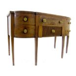 George III flame mahogany breakfront bowed sideboard, comprising five drawers including a cellarette