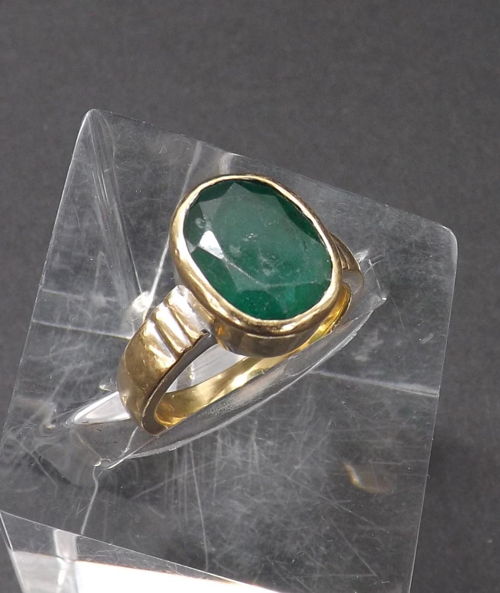 (133129-1-A) Yellow gold emerald single stone ring, the oval-cut emerald in a rub-over setting, 5.