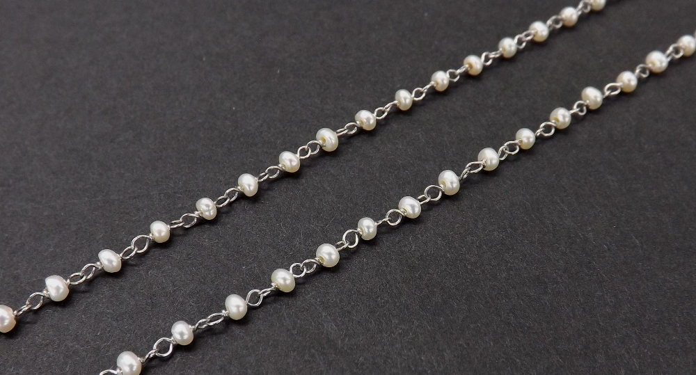 Attractive and delicate platinum seed pearl set necklace, 3.2gm, 17" long overall