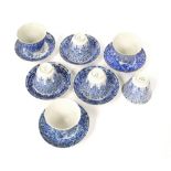 Set of seven Chinese blue and white porcelain tea cups with six saucers, decorated with foliage,
