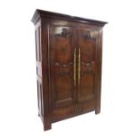 Good French antique oak and fruitwood armoire with inlaid and studded decoration and elaborate brass