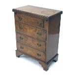 Replica mahogany and burr walnut bachelors chest of four drawers, with hinged top writing surface on