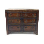 Oak chest of six side by side drawers, the moulded top over carved border decoration on straight