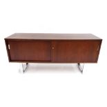 Vintage/retro sideboard with two sliding doors revealing a shelved interior, on chromed steel sled