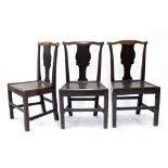 Set of three Georgian oak fiddle back dining chairs with vase splats and solid seats, 36" high,