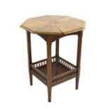 Aesthetic oak octagonal side table, with a galleried undertier on tapering legs, 24" diameter