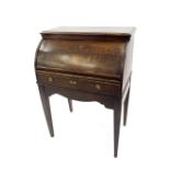 19th century oak cylinder desk, opening to reveal a two tier stepped interior of six small drawers