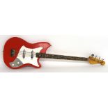 Vintage bass guitar with Vox branded pickups, red finish with imperfections, electrics in working