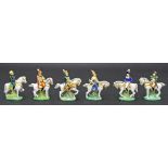 Set of six Continental porcelain figurines modelled as soldiers on horseback, bearing a factory