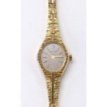 Accurist gold plated and stainless steel lady's bracelet watch, ref. LB507G, silvered oval dial with