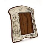 Art Nouveau silver photograph frame, cast in low relief with a maiden feeding doves within a
