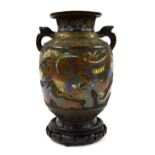 Chinese bronze two-handled champleve vase, with dragon and bird design, 9.5" high, wooden base