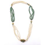 Attractive necklace set with four rows of cultured pearls and three rows of polished emerald