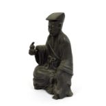 Antique Chinese bronze of a seated scholar, 7.5" high