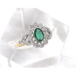 Antique style 18ct oval emerald and diamond ring, the emerald estimated 0.85ct in a diamond surround