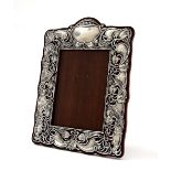Art Nouveau silver photograph frame, with a stylised foliate surround on a replaced mahogany back