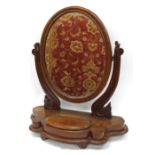 Victorian oval mahogany toilet mirror, the swing glass on a serpentine shaped base with lidded