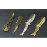 Three novelty brass and metal female leg shoe horns, also a brass shoe horn, the largest 10.75" long