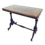 Victorian burr walnut stretcher table, the moulded rectangular top upon ebonised turned supports