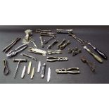 Interesting collection of metalware to include a selection of penknives, nutcrackers, knife rests,