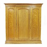 Victorian satin birch triple robe, the moulded cornice over three panelled doors, the centre