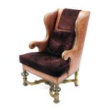 Good 19th century leather upholstered wing library armchair, with later burgundy leather