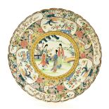 Decorative Cantonese famille rose style charger, decorated to the centre with three ladies in a