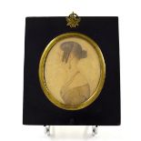 19th Century American School - Miniature portrait of a lady with ringlets, watercolour, 3.5" x 3",