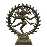 Eastern bronze of a dancing deity, within a circular flaming hoop and standing upon a prostrate