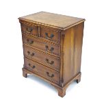 Small replica walnut chest of drawers in the Georgian manner, the moulded top over two short and