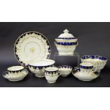 New Hall - part tea set comprising two tea bowls, coffee cup, saucer, sandwich plate and slop bowl