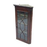 Georgian mahogany hanging corner display cabinet, the beaded cornice over single astragal glazed