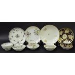 New Hall - four tea bowls/cups with saucers and sandwich plates in pattern nos. 566, U727, 883 and