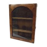 Small glazed mahogany wall mounted collectors cabinet, the arched glazed door enclosing a baize