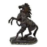 After Guillaume Coustou - bronzed spelter 'Marly Horse' statue on a green marble oval socle, 18.5"