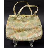 Early 20th century lady's evening bag, finely embroidered with Eastern figures hunting, with a