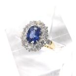 Impressive large 18ct sapphire and diamond oval cluster ring in the antique style, the sapphire of a