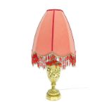Decorative gilt plaster baluster table lamp with shade, decorated in relief with a band of