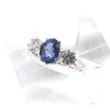 Good platinum sapphire and diamond three stone ring, the oval blue sapphire estimated 1.96ct approx,