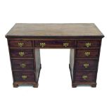 19th century mahogany kneehole desk, the crossbanded top over nine drawers to the kneehole frieze,