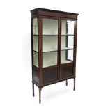 Edwardian mahogany inlaid glazed display cabinet, the moulded top over two glazed doors and sides