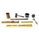 Treen items to include a metal rimmed dipping cup, auctioneer's gavel, puzzle ball, foot measure