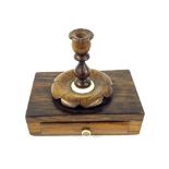 19th century rosewood candle wax holder, with a small taper stick on a box base with a small drawer,