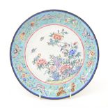 Chinese Cantonese enamel circular dish, painted with flowers, birds and butterflies within pale