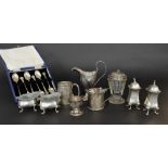 Assortment of silver and condiments to include a George III helmet cream jug, pair of lobed shaped