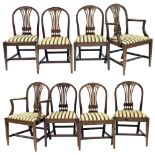 Set of eight Hepplewhite style mahogany dining chairs, with arched wheat carved backs over drop-in