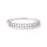 Attractive white gold diamond set hinged bangle, with two rows of round brilliant and marquise