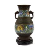Chinese bronze two-handled champleve vase, with chrysanthemum design, 9.5" high, upon a carved